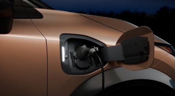 Close-up image of charging cable plugged in | Nissan of Picayune in Picayune MS